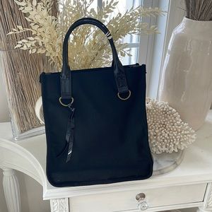 Neiman Marcus black canvas with shiny gussets bag